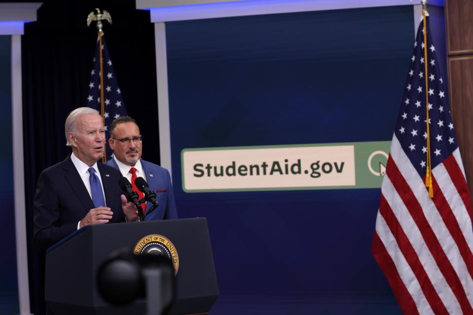 WASHINGTON, DC - OCTOBER 17:  U.S. President Joe Biden  speaks on the student debt relief plan as Secretary of Education Miguel Cardona (R) listens in the South Court Auditorium at the Eisenhower Executive Office Building on October 17, 2022 in Washington, DC. President Biden gave an update on the student debt relief portal beta test.  (Photo by Alex Wong/Getty Images)