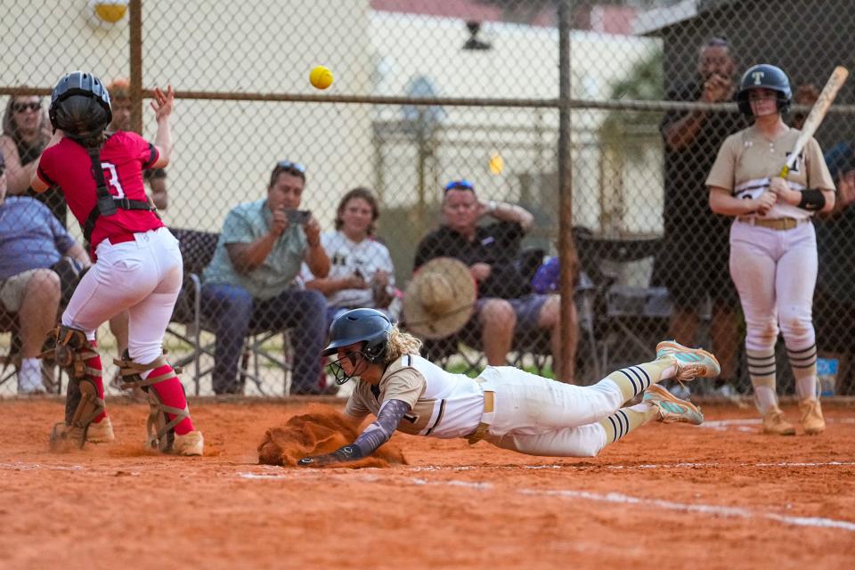 Treasure Coast’s Felicity Fonseca (1) slides into home against Vero Beach in a softball game on Wednesday, March 9, 2022, in Port St. Lucie. Treasure Coast won 6-2. 