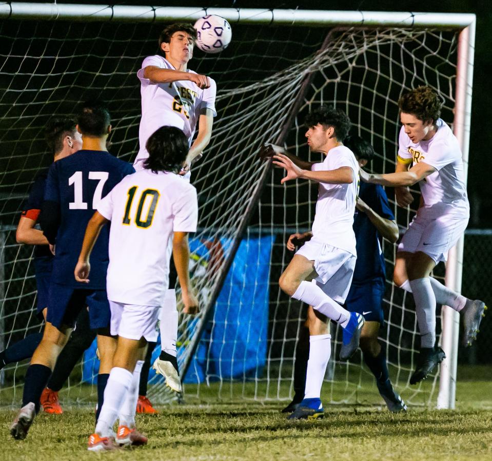 Forest's Adrian Droese (25) tries to head a goal in the second half Friday against Vanguard at Booster Stadium.