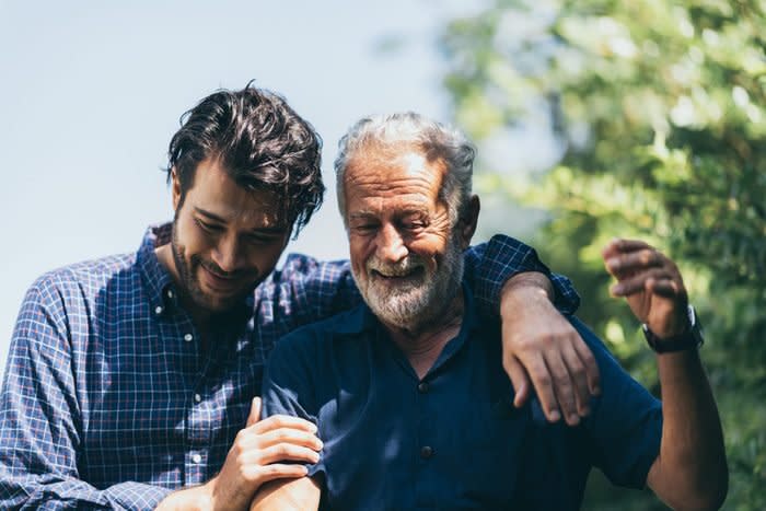 father and son embracing