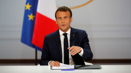 French President Emmanuel Macron speaks during a news conference to unveil his policy response to the yellow vests protest, at the Elysee Palace in Paris, France, April 25, 2019. REUTERS/Philippe Wojazer