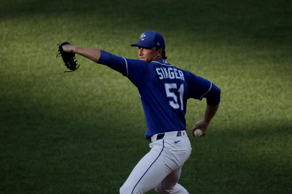 Kansas City Royals pitcher Brady Singer throws during an intrasquad baseball game at Kauffman Stadium on Wednesday, July 8, 2020, in Kansas City, Mo. (AP Photo/Charlie Riedel)