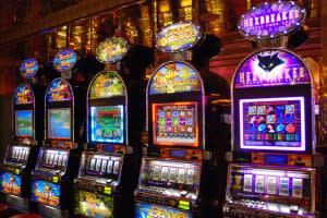 Slot machines on a cruise ship draw passengers with their flashing lights. Courtesy of Raging Wire via flickr