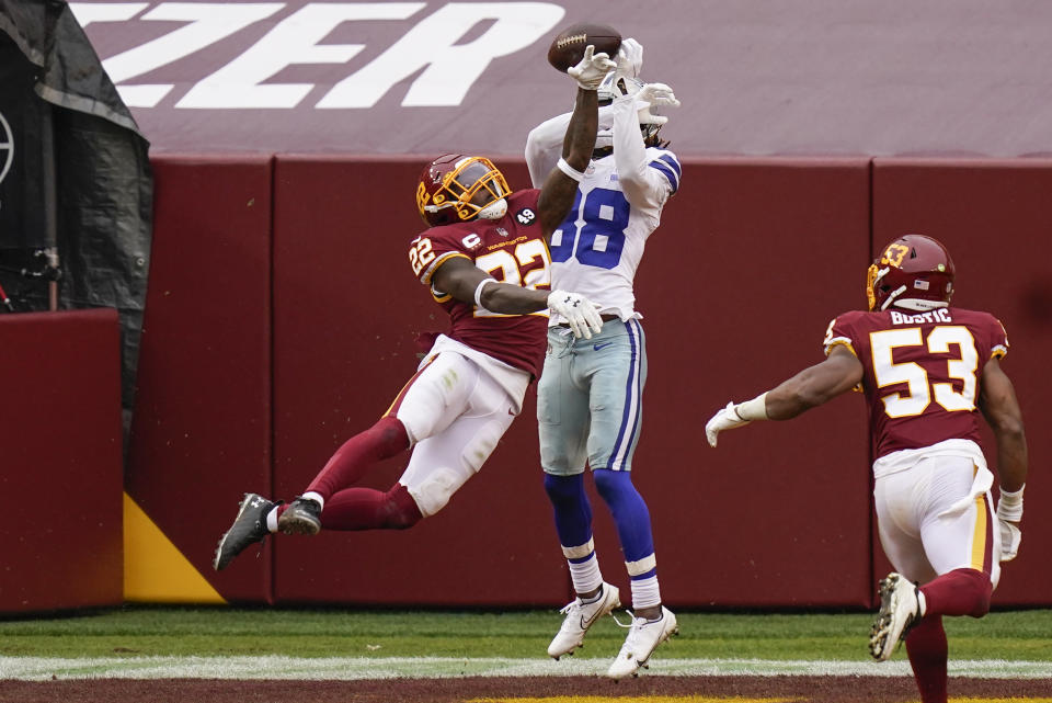 Washington Football Team safety Deshazor Everett (22) stops Dallas Cowboys wide receiver CeeDee Lamb (88) from making a catch. (AP Photo/Patrick Semansky)