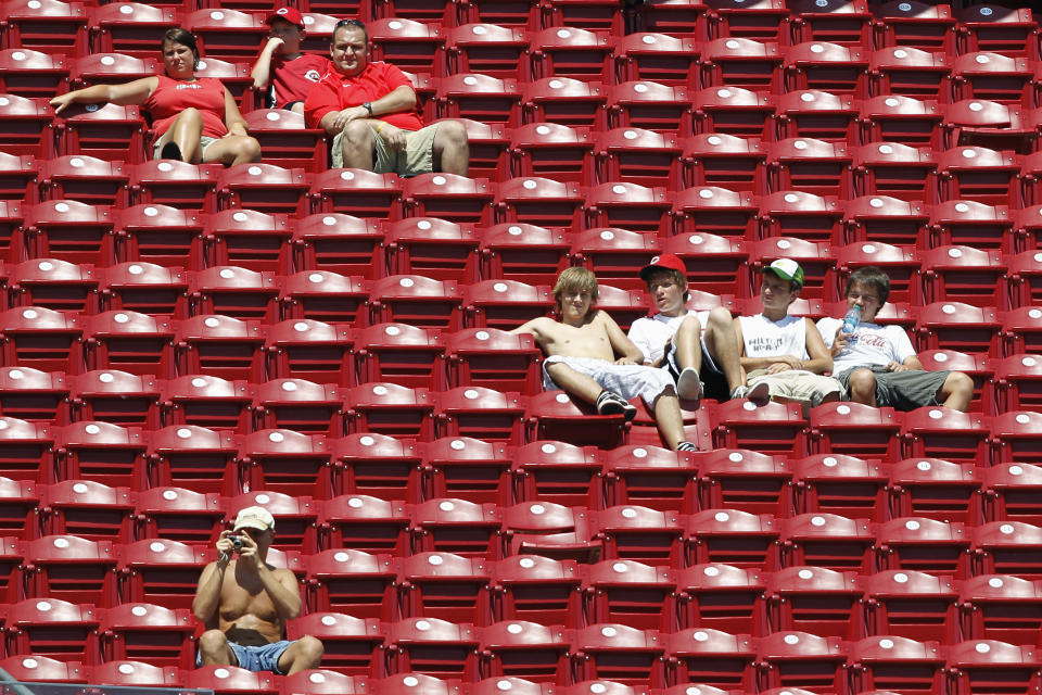 Cincinnati Reds fans look on from a section of empty seats during the game against the Colorado Rockies at Great American Ball Park on August 11, 2011 in Cincinnati, Ohio. The Reds won 2-1. (Photo by Joe Robbins/Getty Images)