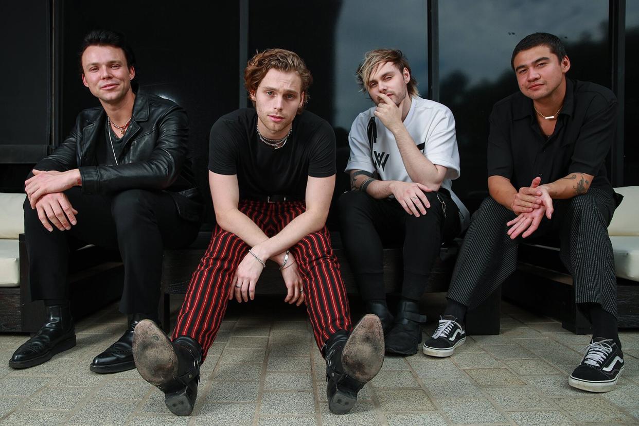 Ashton Irwin, Luke Hemmings, Michael Clifford and Calum Hood of 5 Seconds of Summer pose during a photo shoot in Sydney, New South Wales.
