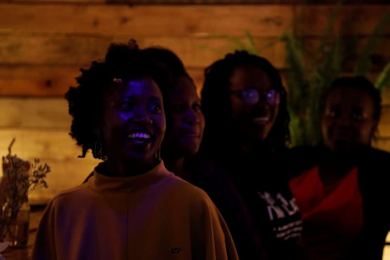 People in the audience laugh during a standup show by Kenyan comedian Brian Onjoro at the Kez's Kitchen restaurant in Nairobi