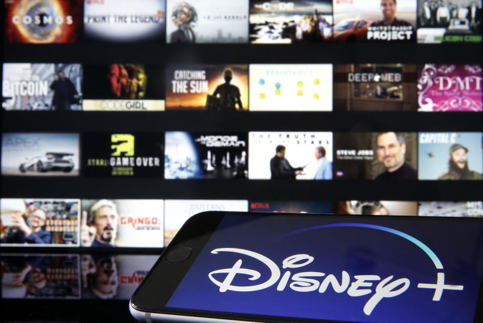 PARIS, FRANCE - MARCH 28: In this photo illustration, Disney + logo is diplayed on the screen of an iPhone in front of a television screen showing a Disney + logo on March 28, 2020 in Paris, France. At the request of the French government, the Disney + streaming platform has decided to postpone its launch in France to April 7. (Photo Illustration by Chesnot/Getty Images)