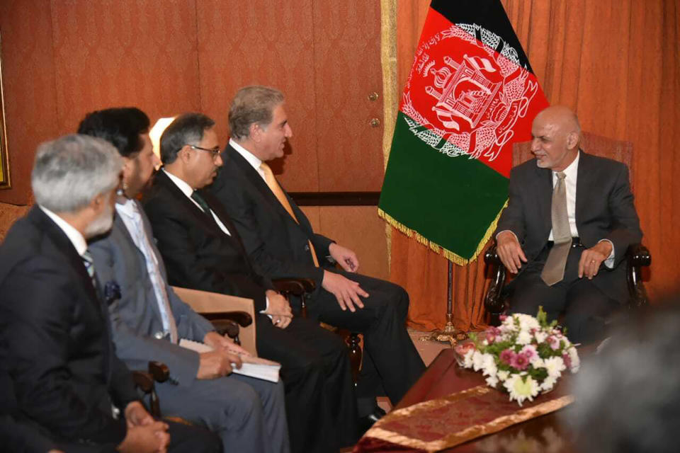 In this photo released by the Foreign Office, Pakistani Foreign Minister Shah Mehmood Qureshi, second from right, talks with visiting Afghan President Ashraf Ghani in Islamabad, Pakistan, Thursday, June 27, 2019. Ghani has arrived on his first visit to Pakistan, in an attempt to forge a fresh relationship with Prime Minister Imran Khan's government and reach out to Islamabad for help in getting the Taliban to talk peace with Kabul.(Pakistan Foreign Office via AP)