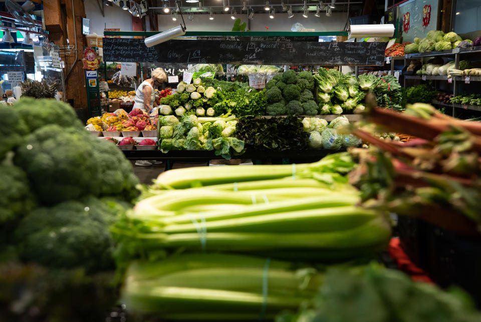A woman shops for produce in Vancouver, on Wednesday, July 20, 2022. Statistics Canada's latest consumer price index price index data shows food inflation continued to dip in March. THE CANADIAN PRESS/Darryl Dyck