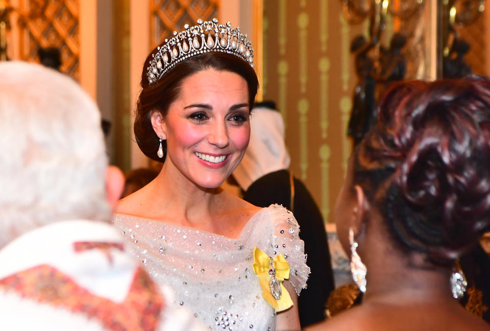 Catherine, Duchess of Cambridge wears a tiara while greeting guests at an evening reception for members of the Diplomatic Corps at Buckingham Palace on December 04, 2018 in London, England