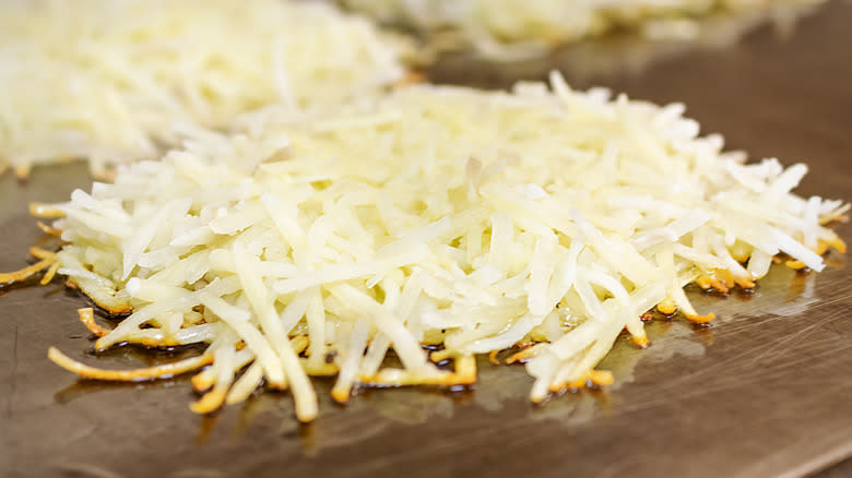 hash browns frying on flat top