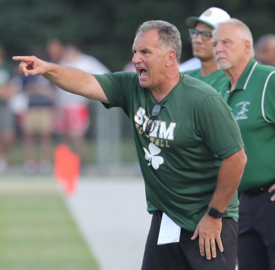 St. Vincent-St. Mary head coach Terry Cistone barks at his defense during the second quarter against Glenville on Thursday, Aug. 18, 2022 in Akron, Ohio, at John Cistone Field.