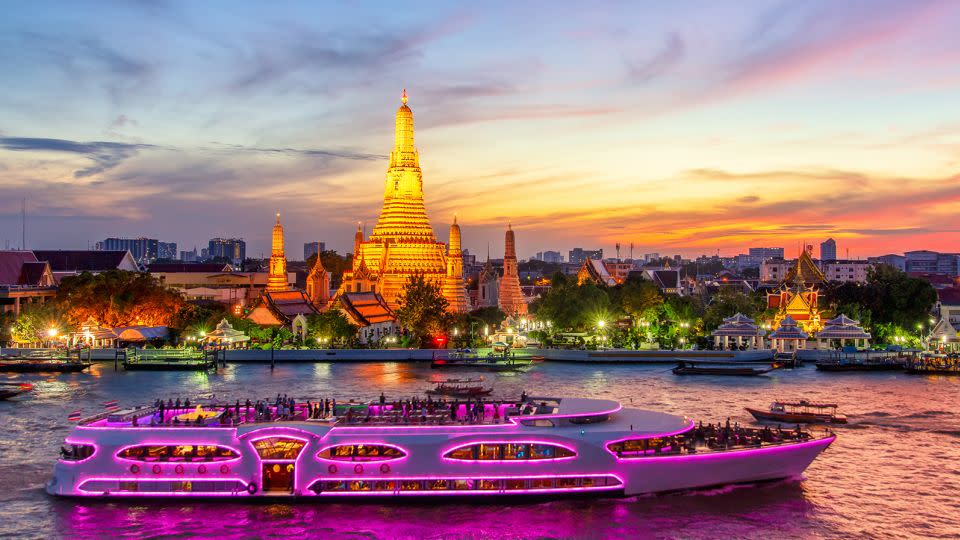 A boat glides past Wat Arun in Bangkok, Thailand. The legal drinking age in Thailand is 20. - Pakin Songmor/Moment RF/Getty Images