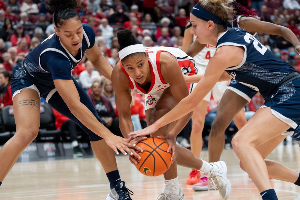 Ohio State guard Taylor Thierry fights for a rebound against Penn State on Sunday.