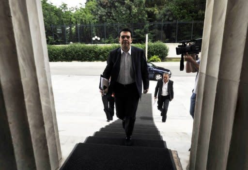 The Greek leader of the Radical Left (Syriza) coalition, Alexis Tsipras, arrives at parliament in Athens. The head of Greece's radical left-wing Syriza party said Tuesday his cabinet will reject all austerity measures imposed under an EU-IMF loan deal, if he manages to form a new government