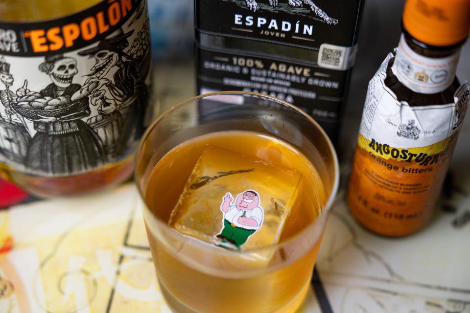 Kapow Noodle Bar mixologist Angela Dugan has created four cocktails for Father's Day that honor iconic TV dads. Each features a single ice cube with the face of the dad like Peter Griffin from "Family Guy," floating in the "Shut Up, Meg" cocktail.