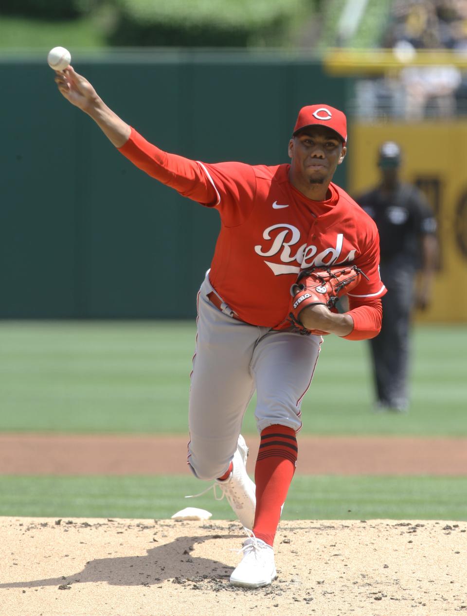 May 15, 2022; Pittsburgh, Pennsylvania, USA;  Cincinnati Reds starting pitcher Hunter Greene (21) delivers a pitch against the Pittsburgh Pirates during the first inning at PNC Park. Mandatory Credit: Charles LeClaire-USA TODAY Sports