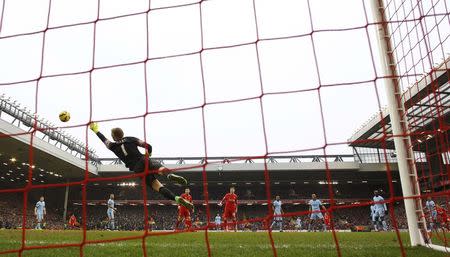 Liverpool's Philippe Coutinho (R) scores the second goal for his side as Manchester City's Joe Hart dives for the ball. Liverpool v Manchester City - Barclays Premier League - Anfield - 1/3/15. Reuters / Phil Noble Livepic