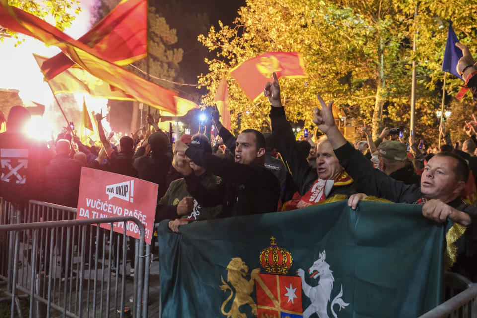 People protest against new speaker of parliament Andrija Mandic in front of parliament building in Montenegro's capital Podgorica, Monday, Oct. 30, 2023. After months of political bickering, the parliament in NATO-member and EU candidate Montenegro is set to hold a vote Monday on the small Balkan country's proposed new government that will hinge on the support from pro-Russian and anti-Western groups. Following months of negotiations, the winning coalition received the backing from staunchly anti-Western groups under the condition that one of their leaders, Andrija Mandic, is voted Monday the parliament speaker — an influential political position. (AP Photo/Risto Bozovic)