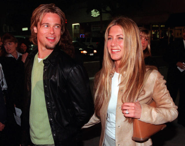 FILE - In this March 14, 2000 file photo, actor Brad Pitt, left, and actress Jennifer Aniston, arrive at the premiere of the new film &quot;Erin Brockovich,&quot; in the Westwood section of Los Angeles. Angelina Jolie Pitt has filed for divorce from Brad Pitt, bringing an end to one of the world's most star-studded, tabloid-generating romances. This is the second marriage for Pitt, who previously wed Jennifer Aniston. (AP Photo/Chris Pizzello, File)