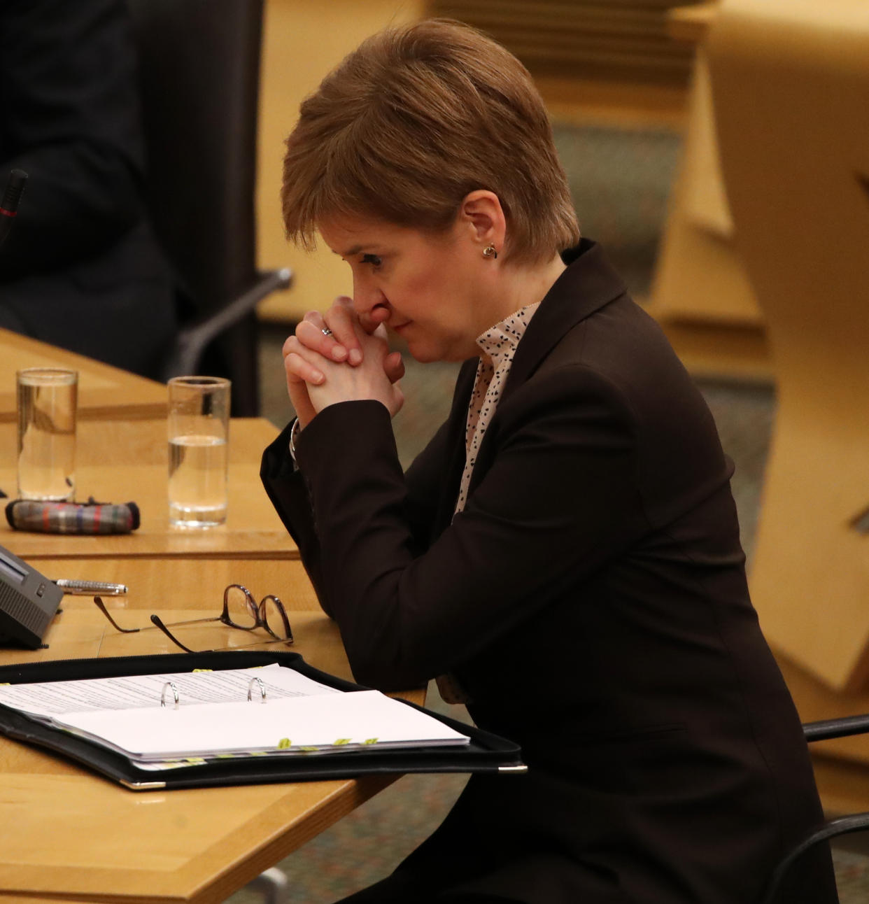 First Minister Nicola Sturgeon reacts as she delivers a statement at Holyrood, Edinburgh, announcing that Scotland will be placed in lockdown from midnight for the duration of January with a legal requirement to stay at home except for essential purposes.