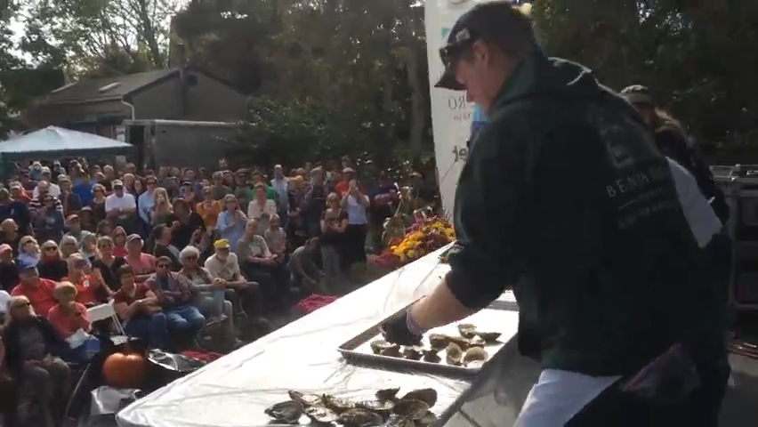 Three finalists vie for glory and a $1,000 prize in the championship round of the Shuck-Off competition at the 2017 Wellfleet OysterFest. (Cape Cod Times file photo)