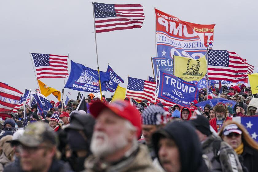 FILE - Trump supporters participate in a rally in Washington, Jan. 6, 2021, that some blame for fueling the attack on the U.S. Capitol. On Thursday, Feb. 8, the nation's highest court is scheduled to hear arguments in a case involving Section 3 of the 14th Amendment, which prohibits those who "engaged in insurrection or rebellion" from holding office. The case arises from a decision in Colorado, where that state's Supreme Court ruled that Trump violated Section 3 of the 14th Amendment and should be banned from ballot. (AP Photo/John Minchillo, File)