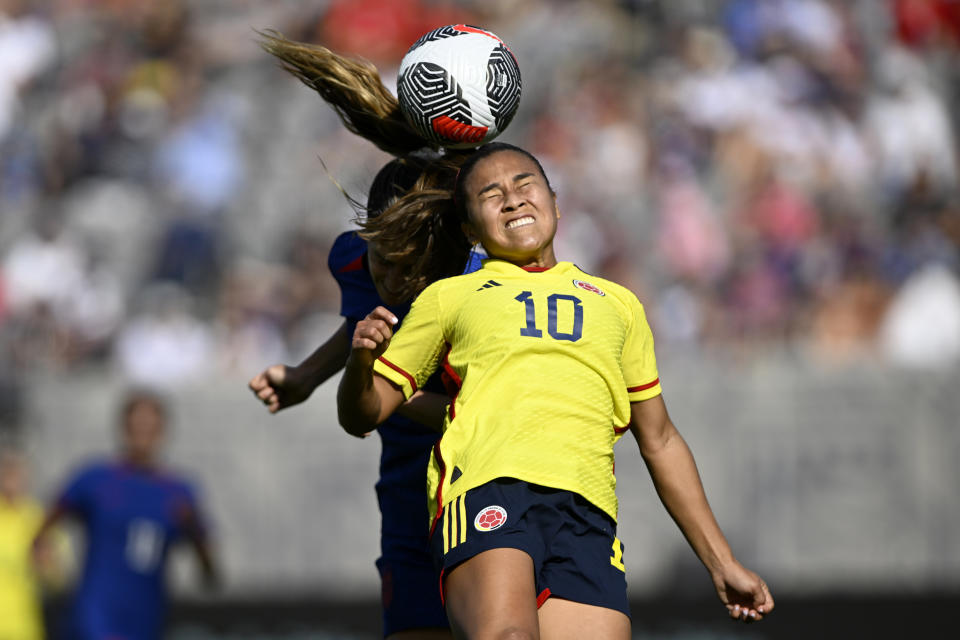 Colombia midfielder Leicy Santos (10) competes for a header with United States midfielder Savannah DeMelo, left, during the first half of an international friendly soccer match Sunday, Oct. 29, 2023, in San Diego. (AP Photo/Alex Gallardo)