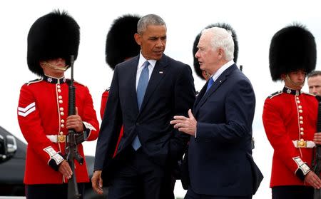 U.S. President Barack Obama walks past an honor guard, escorted by Governor General David Johnston (R) upon his arrival to attend the North American Leaders' Summit in Ottawa, Canada June 29, 2016. REUTERS/Kevin Lamarque