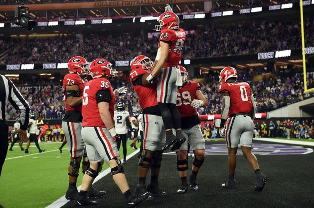 Bulldogs wide receiver Ladd McConkey is lifted into the air by Willock after catching a pass for a touchdown during the College Football Playoff National Championship game on Jan. 9 in Inglewood, California.