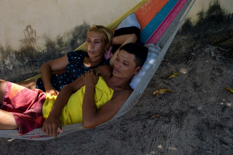 Homeless Venezuelans who fled the economic chaos in their home country sleep in a hammock by the side of the road in the Brazilian town of Boa Vista, where they are penniless and stranded