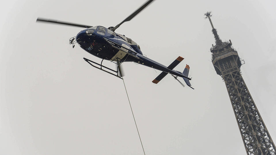 A helicopter helped install the new antenna. - Credit: Isa Harsin/AP