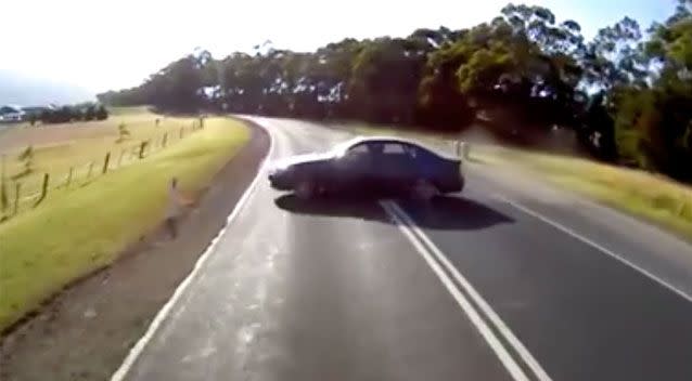 Dashcam footage shows the driver slowly performing a U-turn in the middle of the road. Source: Dash Cam Owners Australia/ Facebook