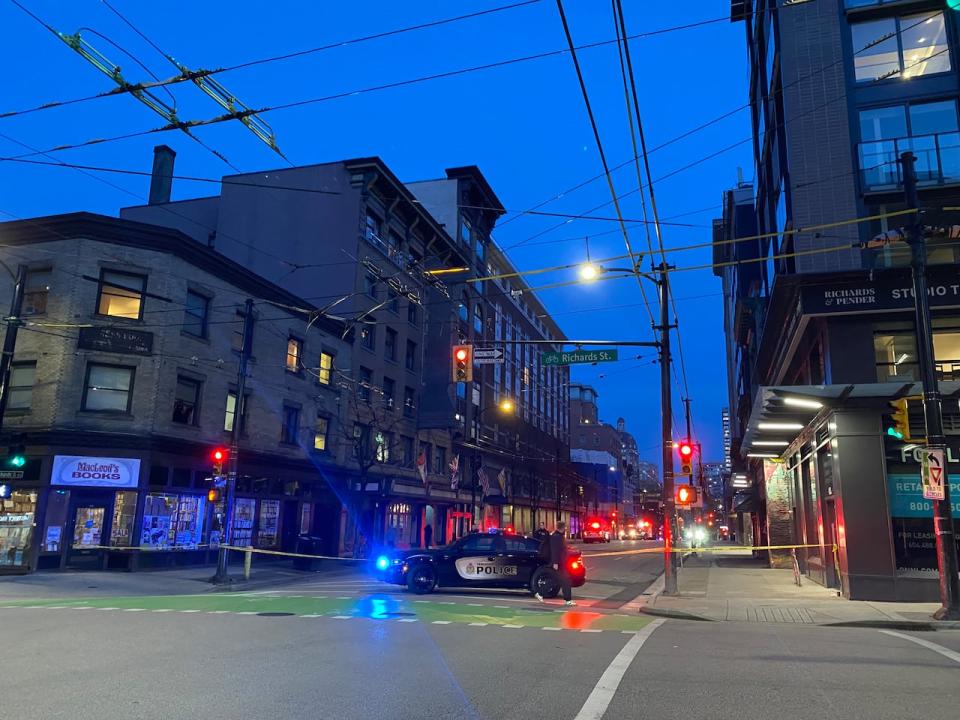 A large area was cordoned off by Vancouver police officers, as they investigated a shooting near Homer Street and West Pender Street April 3, 2024. (Michelle Morton/CBC - image credit)