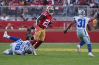 Aug 9, 2018; Santa Clara, CA, USA; San Francisco 49ers running back Jerick McKinnon (28) escapes Dallas Cowboys defensive end Tyrone Crawford (98) before being tackles by cornerback Byron Jones (31) during the first quarter at Levi's Stadium. Kelley L Cox-USA TODAY Sports