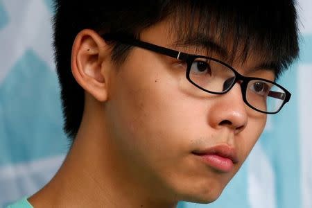 Student leader Joshua Wong looks on outside a court before a verdict, on charges of inciting and participating in an illegal assembly in 2014 which led to the "Occupy Central" pro-democracy movement, in Hong Kong August 15, 2016. REUTERS/Bobby Yip