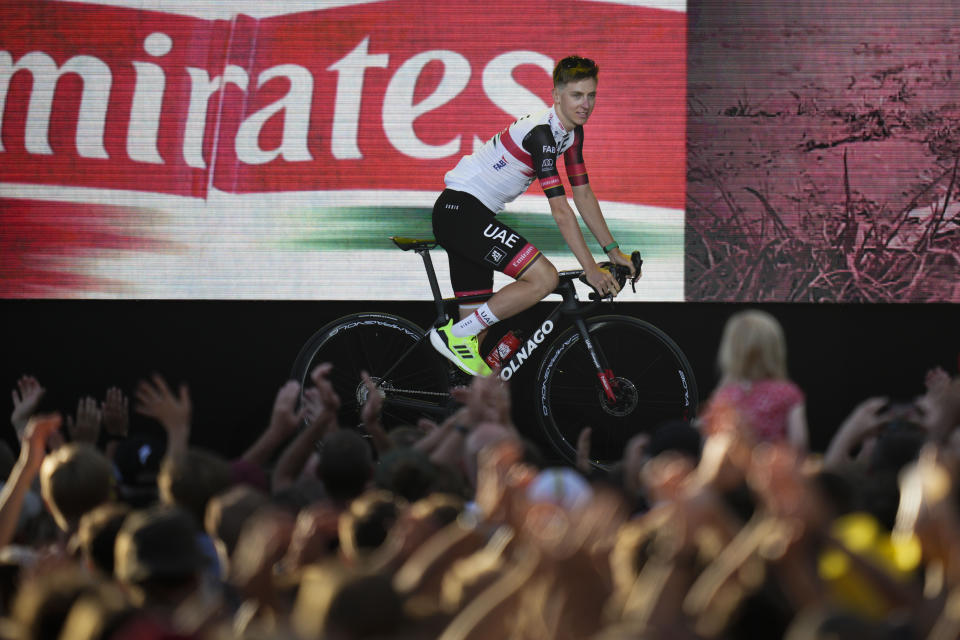 2020 and 2021 Tour de France winner Tadej Pogacar of Slovenia rides on the podium during the team presentation ahead of the Tour de France cycling race in Copenhagen, Denmark, Wednesday, June 29, 2022. The race starts Friday, July 1, the first stage is an individual time trial over 13.2 kilometers (8.2 miles) with start and finish in Copenhagen. (AP Photo/Daniel Cole)