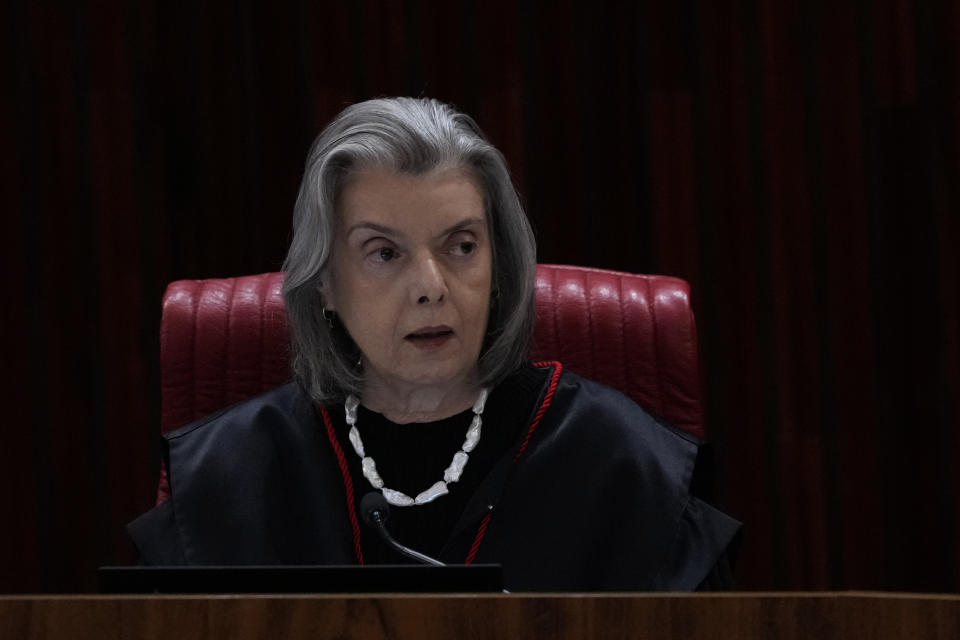 Minister of the Supreme Electoral Court Carmen Lucia reads her vote during the trial of former President Jair Bolsonaro at the Supreme Court in Brasilia, Brazil, Friday, June 30, 2023. The panel of judges voted Friday to render Bolsonaro ineligible to run for office again after concluding that he abused his power and cast unfounded doubts on the country’s electronic voting system. (AP Photo/Eraldo Peres)