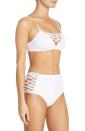 <p>How cute is the peek-a-boo lattice work on the bust and hips of this white hot bikini by L Space? <i>($119 <a href="http://shop.nordstrom.com/o/l-space-bikini-top-bottoms/4419763?origin=category-personalizedsort" rel="nofollow noopener" target="_blank" data-ylk="slk:at Nordstrom;elm:context_link;itc:0;sec:content-canvas" class="link ">at Nordstrom</a>)</i></p>