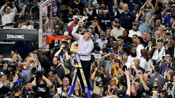 PHOTO: Head coach Dan Hurley of the Connecticut Huskies reacts as he cuts down the net after defeating the San Diego State Aztecs 76-59 during the NCAA Men's Basketball Tournament National Championship game at NRG Stadium, April 03, 2023 in Houston. (Logan Riely/Getty Images)