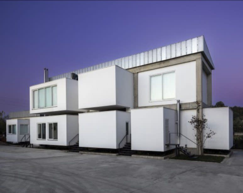 This concrete factory in North Kandovan by Shaygan Gostar makes similar use of box-like additions.