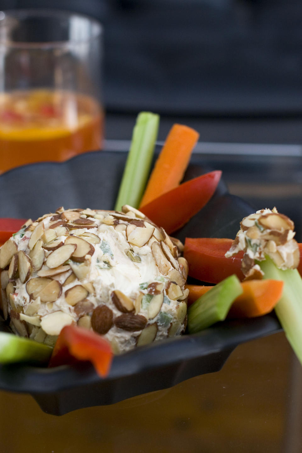 In this Feb. 13, 2012 photo taken in Concord, N.H., a recipe for an almond coated cheese ball platter is shown. (AP Photo/Matthew Mead)