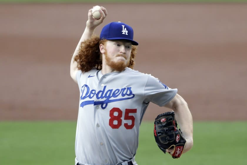 Los Angeles Dodgers starting pitcher Dustin May works against a San Diego Padres batter.