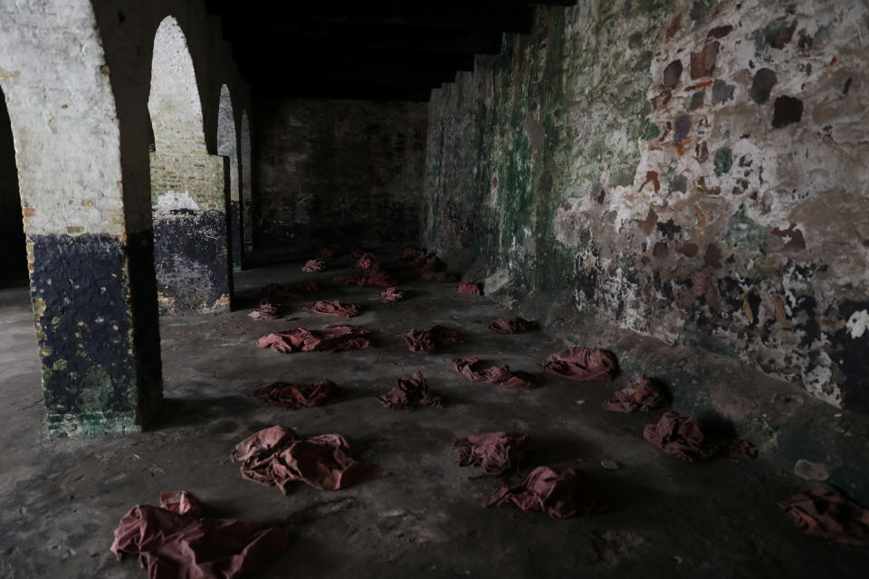 Clothes left behind by performers reenacting what female slaves went through during their detention at the Elmina Castle, lie on the floor at the castle in Ghana. (Photo: Siphiwe Sibeko/Reuters)