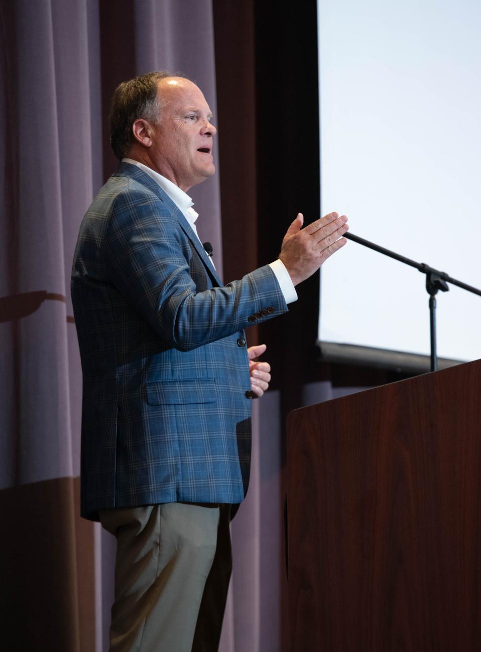 David Magee, author and the creator of The William Magee Institute for Student Wellbeing at the University of Mississippi, speaks about how adolescents nationwide are struggling with mental health and substance misuse issues during CivicCon at the Brownsville Community Center in Pensacola on Tuesday, Aug. 15, 2023.