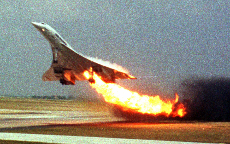 FILE - In this July 25, 2000, file photo, Air France Concorde flight 4590 takes off with fire trailing from its engine on the left wing from Charles de Gaulle airport in Paris. A French appeals court is expected to decide on Thursday, Nov. 29, 2012, whether to uphold a manslaughter conviction against Continental Airlines for the crash over a decade ago of an Air France Concorde that killed 113 people. Continental Airlines, Inc. and one of its mechanics were convicted in 2010. (AP Photo/Toshihiko Sato, File) MANDATORY CREDIT; JAPAN OUT