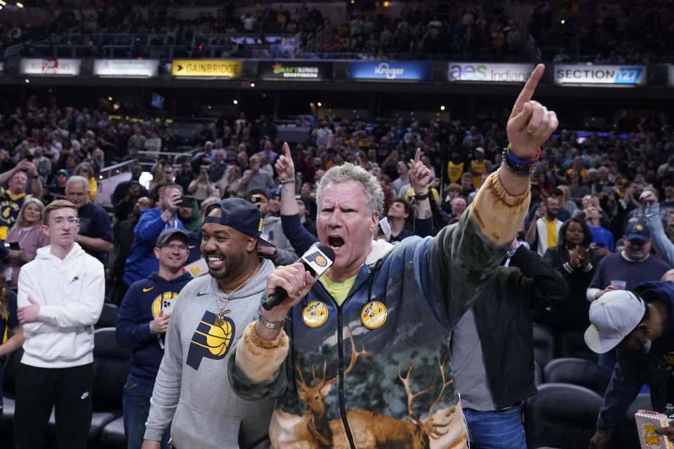 Actor Will Ferrell shouts to fans before an NBA basketball game between the Indiana Pacers and the Philadelphia 76ers, Monday, March 6, 2023, in Indianapolis. (AP Photo/Darron Cummings)