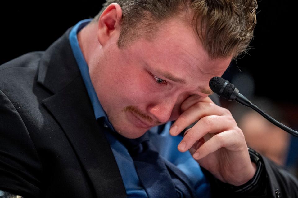 Marine Sgt. Tyler Vargas-Andrews, who was gravely injured, losing an arm and a leg in a suicide attack at Hamid Karzai International Airport in Kabul, becomes emotional as he recounts his story during a House Committee on Foreign Affairs hearing  in Washington.