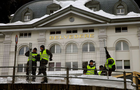 Soldiers of the Swiss army build protection fences for the upcoming World Economic Forum in front of Hotel Belvedere in the Swiss mountain resort of Davos, Switzerland, January 11, 2018. REUTERS/Arnd Wiegmann